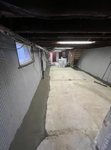 Interior basement wall with dimple membrane installed from floor to ceiling
