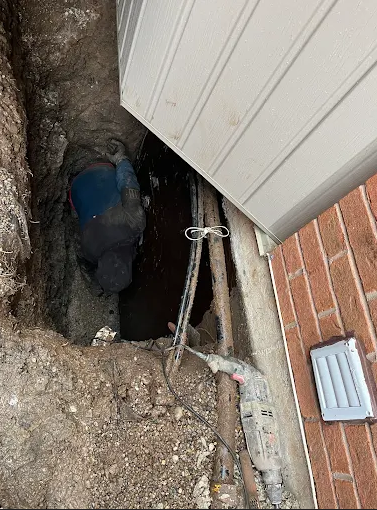 Basement interior with dimple membrane and concrete drainage channel